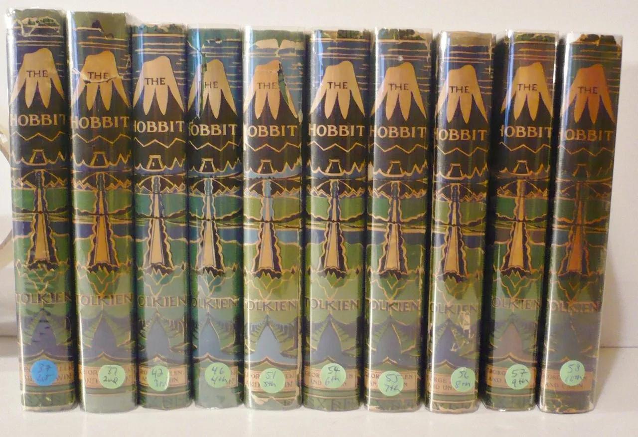 Eleven first-edition Hobbit impressions lined up by printing, the kind of detail The Tolkien Collector's Guide® helps you identify