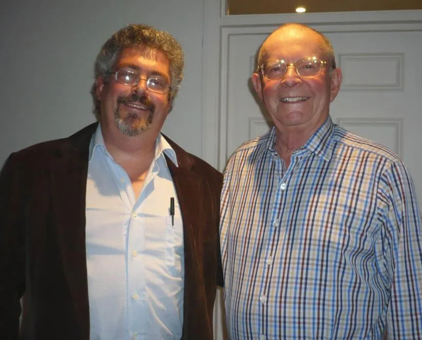 Mark Faith (left) standing with bestselling author Wilbur Smith, whose first and signed editions he also dealt
