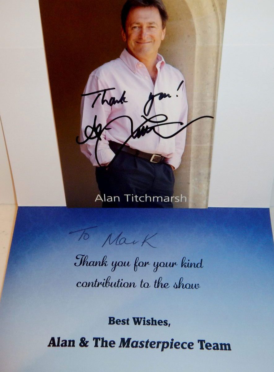 Autographed headshot above handwritten thank-you card