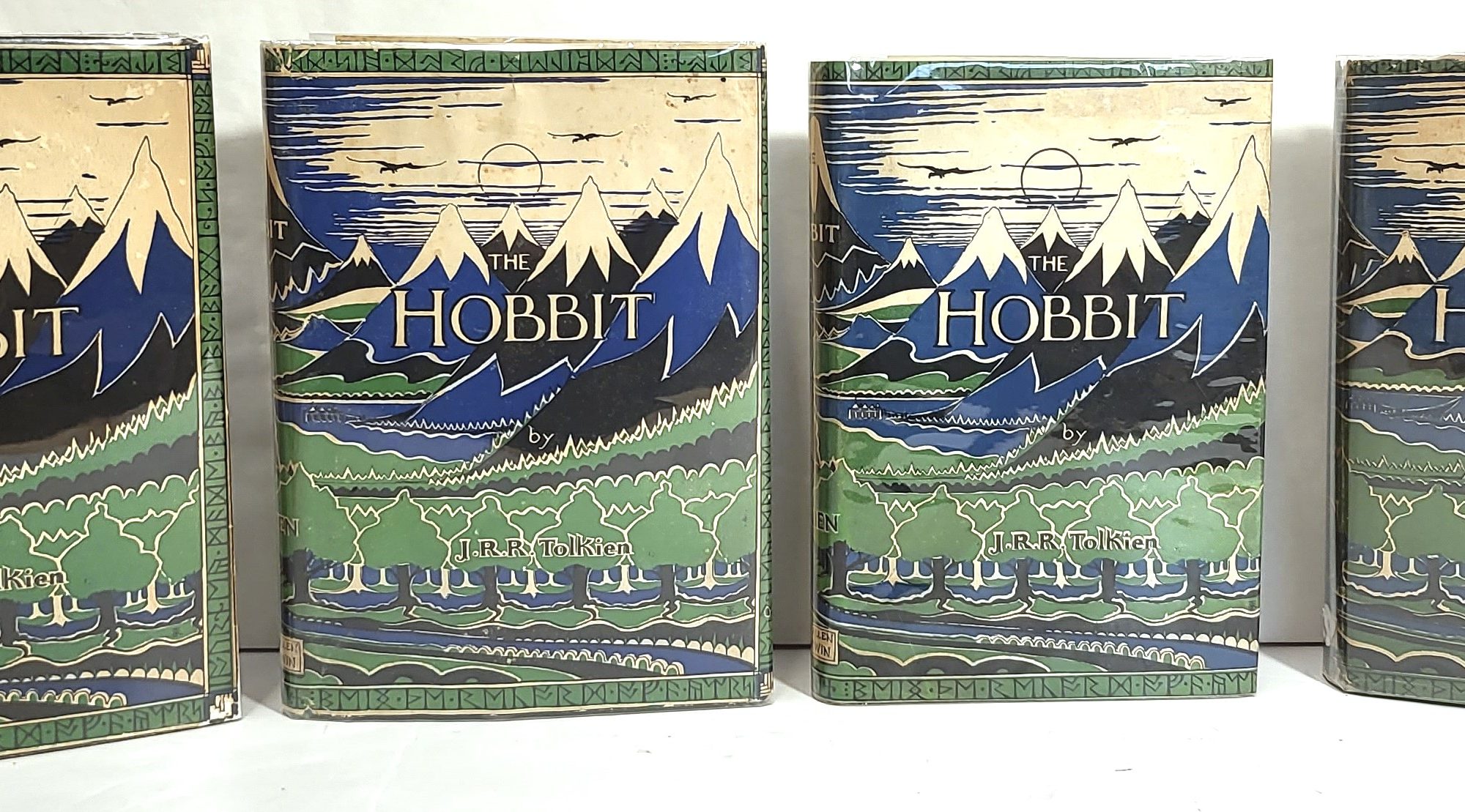 Four vintage editions of The Hobbit